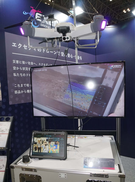 ドローン 新品 エクセディ、ジャパンドローンで開発中の消防用放水ドローンを展示