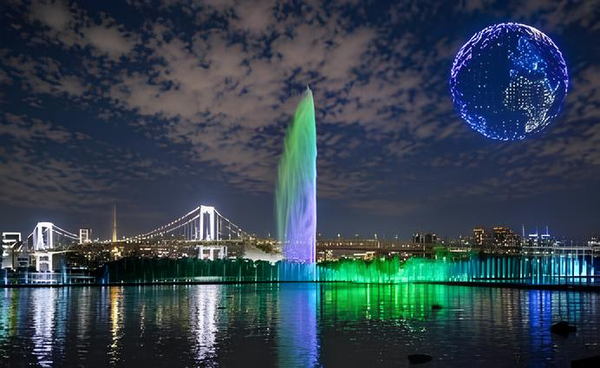 ライトアップされた噴水とドローンショーのイメージ